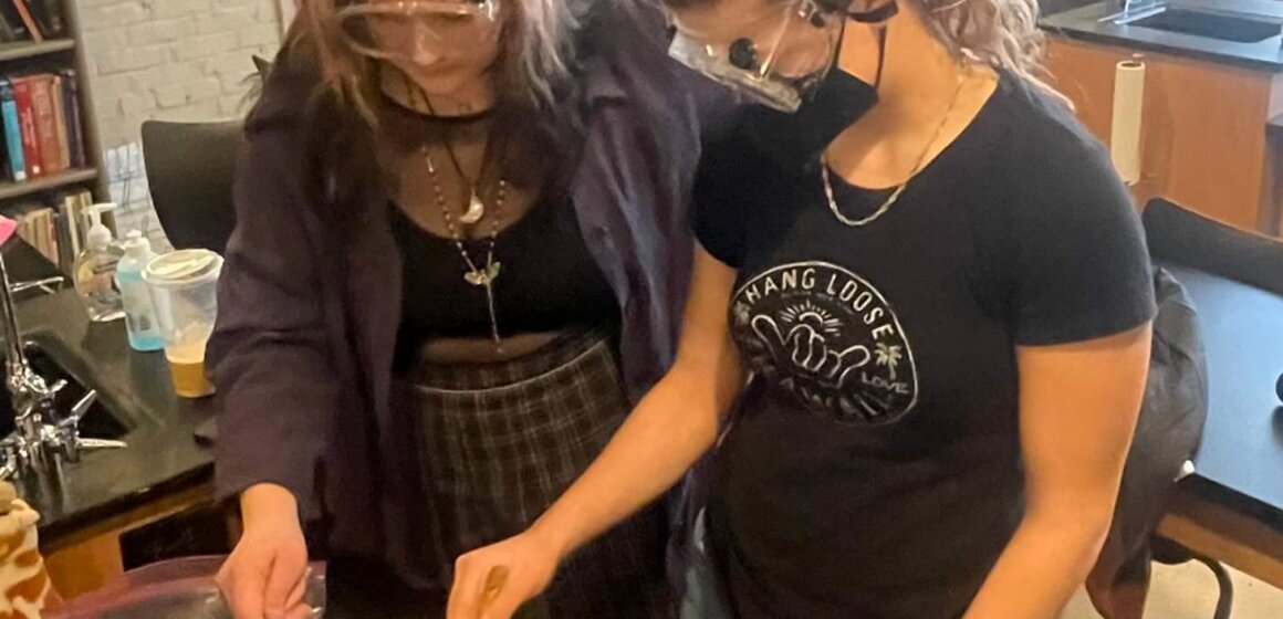 The chemistry class makes ice cream using dry ice.