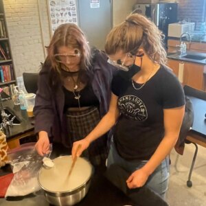 The chemistry class makes ice cream using dry ice.