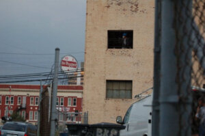 2010 - Exterior view of new Community High School building (to open in fall 2011) with downtown Roanoke's Dr Pepper sign in the background. 2010 Old Warehouse Building